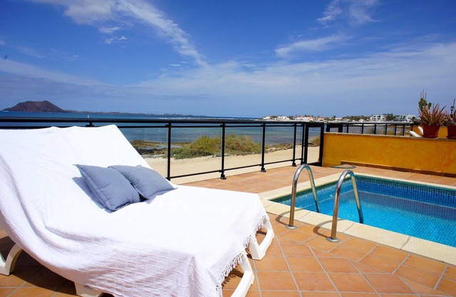 Luxurious beachfront vacation rental home with heated salt water pool