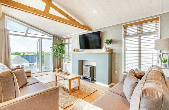 Luxurious lodge with vaulted ceilings and a welcoming feature fireplace.