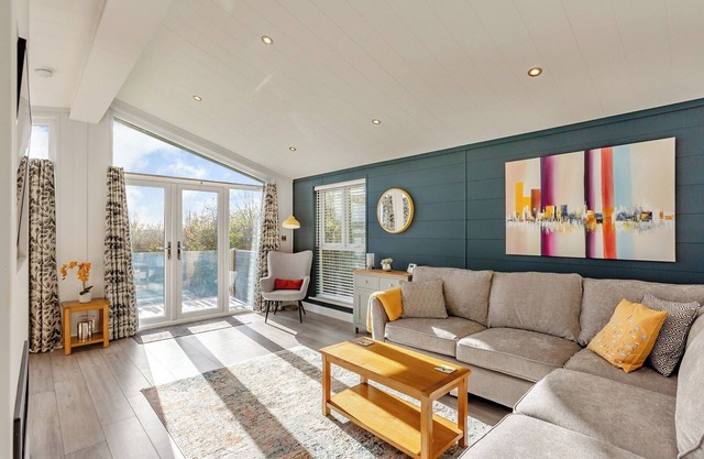 Luxurious lodge with vaulted ceilings and a welcoming feature fireplace.
