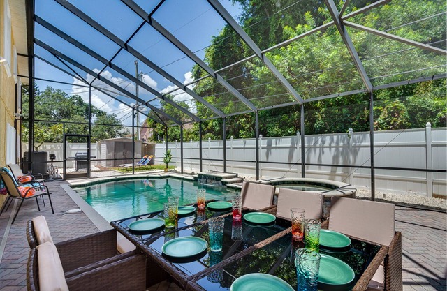 Luxury 5 Bedroom Dunedin home ~ TWO full kitchens, heated pool, hot tub!