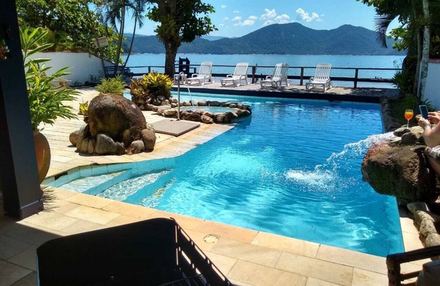 Luxury Beach house standing in front sand sea, pool and terrace