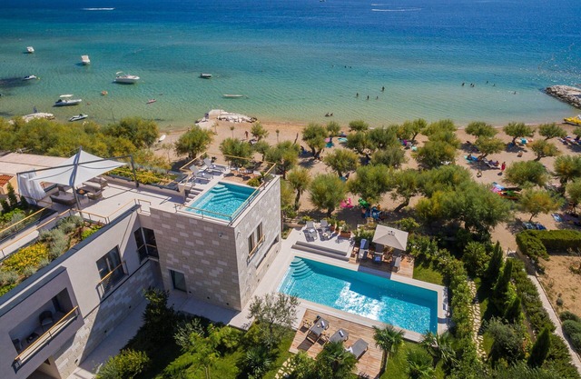 Luxury beachfront VILLA FLORES heated outdoor and indoor swimming pool