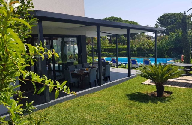 Luxury detached villa with tropical garden and large private pool. Fully walled