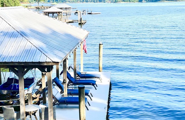 Luxury lakefront home with a covered private dock & large game room