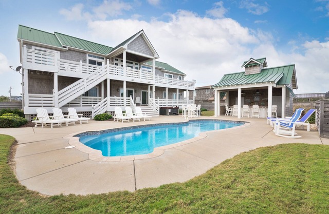 Luxury Southern Shores home with Private Pool, Hot Tub with Pool Bar, Game Room, and Theatre Room