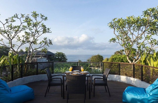 Luxury villa with rooftop viewing sea and rice field.