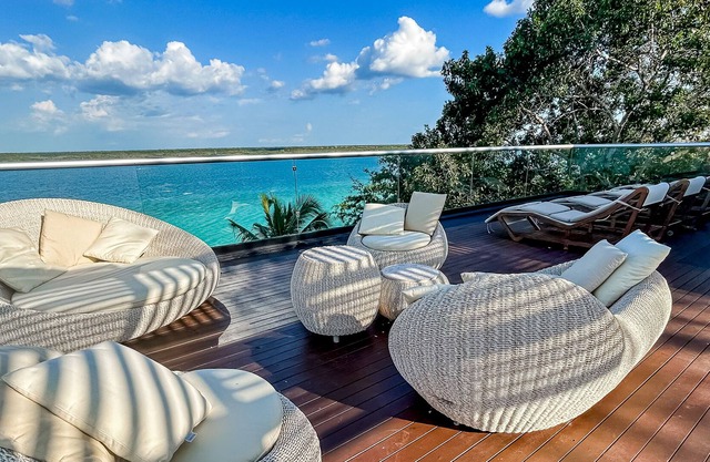 Luxury waterfront villa with dock, pool, hot tub, outdoor areas, & billiards