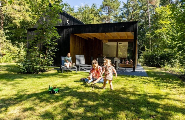 Luxury wellness bungalow for 6 people with private sauna and whirlpool overlooking the forest.
