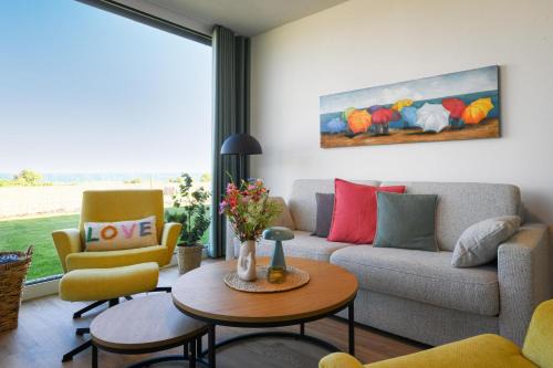 Lykke – Traumhafte Ferienwohnung mit Garten und Meerblick in erster Reihe!