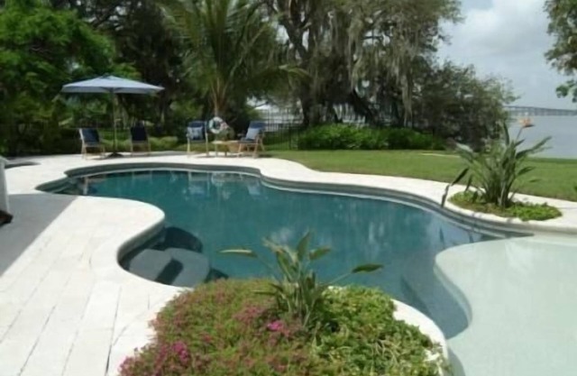 Magical Waterfront Home, Sunsets,Guest House, Beach, Dock, game room, Playground