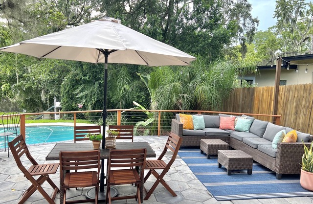 Mid-Century Boho Chic home with Pool, Game Room & Outdoor Playhouse.