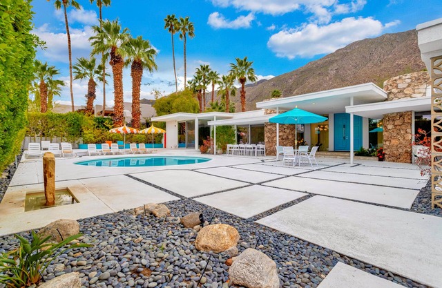 Mid-century modern estate with a pool, hot tub, gourmet kitchen, and fireplace