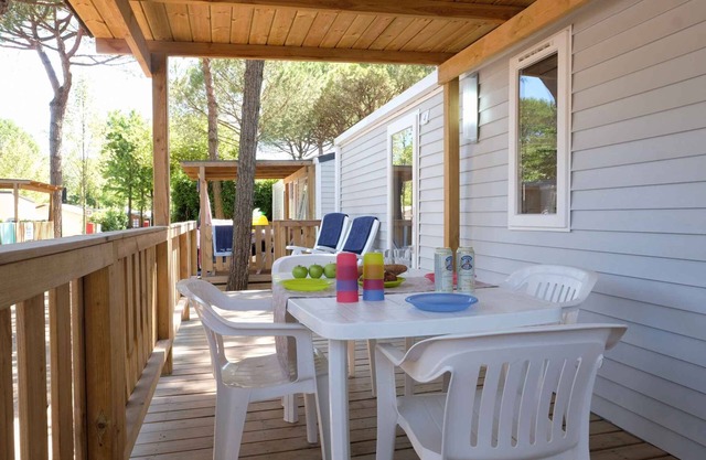 Mobilehome with half-imagined wooden terrace