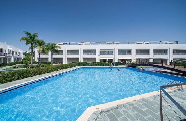 Modern 2-bedroom luxury apartment with patio and large communal swimming pool