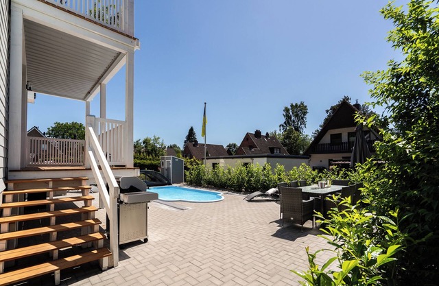 Modern and spacious vacation apartment with heated pool and terrace near the Baltic Sea