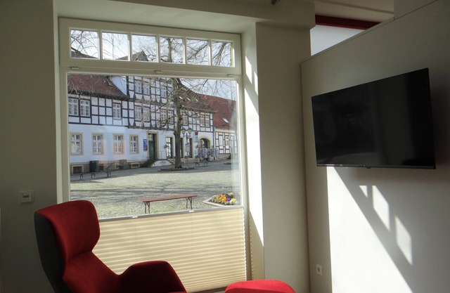 Modern apartment with a fireplace in a listed half-timbered house on the market square