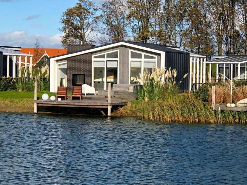 Modern chalet with jetty and terrace