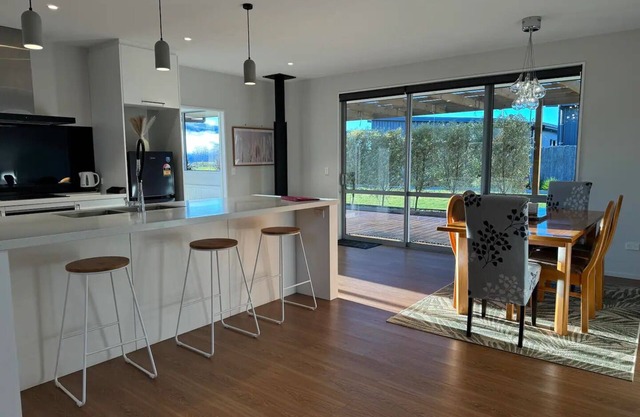 Modern family home, large backyard with breathtaking lake and mountain views.