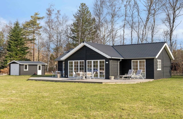 Modern holiday home with large garden near beach