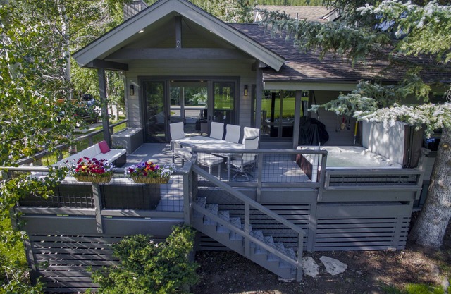 Modern home on creek and golf course with mountain views; ideal 2 families