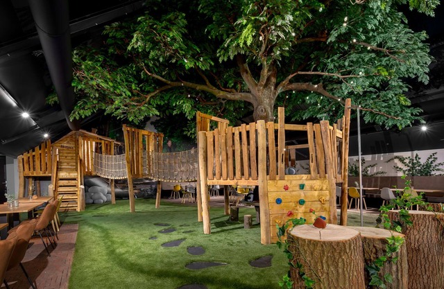 Modern lodge with combi-microwave within green surroundings