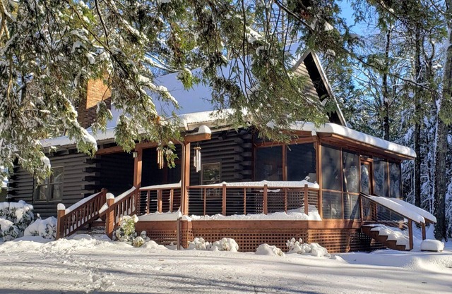 Modern log cabin sited on six acres of land, private and secluded, serene.