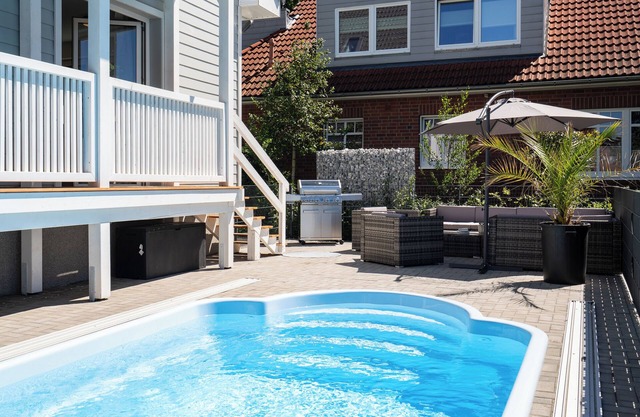 Modern vacation apartment with heated pool, balcony and terrace near the Baltic Sea