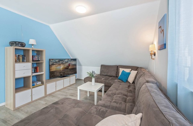 Modern vacation apartment in Loddin with garden, WLAN & playground - quiet and on the beach