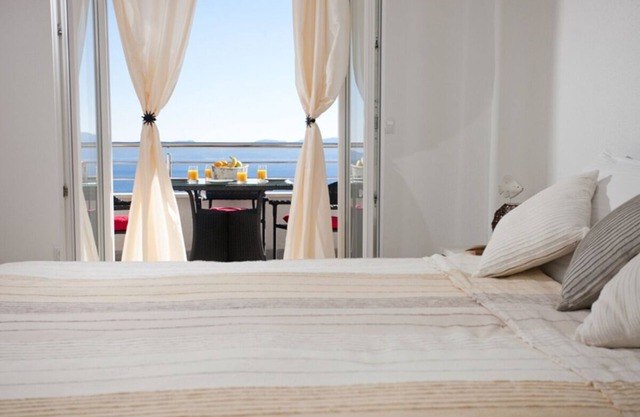 Modern vacation apartment with pool and sea view