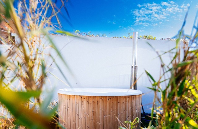 Modern vacation home with sauna and hot tub for families with children + friends