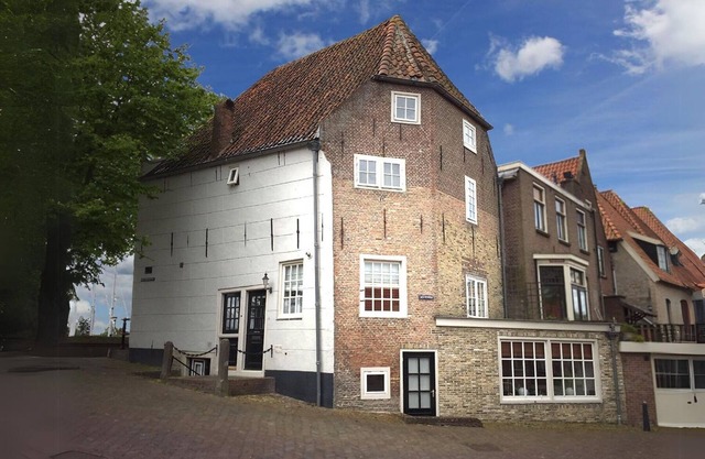 Monumental Dutch house in old center on harbor. Unique and luxurious location!