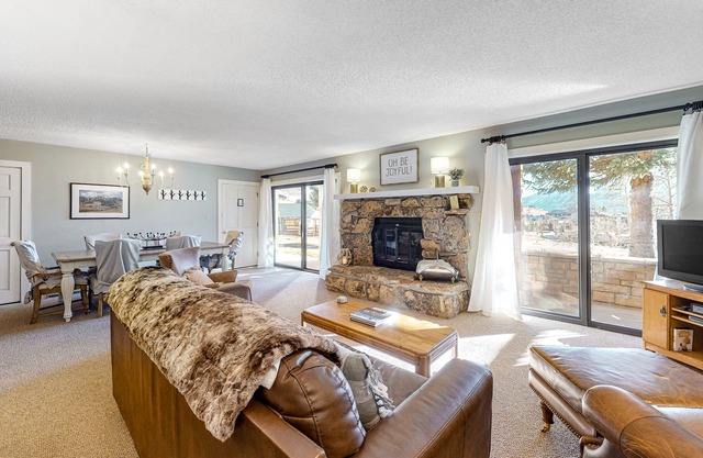 Mountain-view condo with private deck, fireplace & hot tub