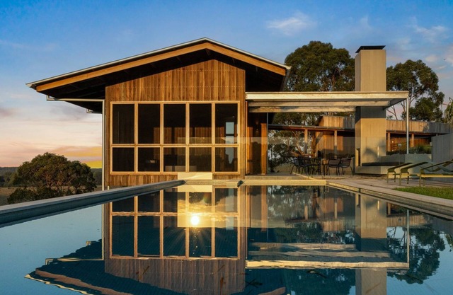 Myocum Ridge Farm - A winding driveway, cows, blue skies, manicured lawns, glittering pool
