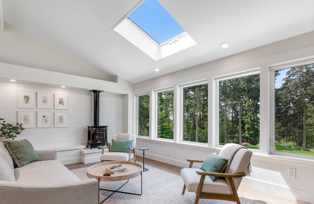 New construction - upper-level home with expansive deck & orchard views