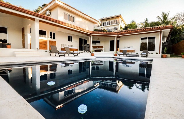 New Custom Home w/Pool & Ocean View - in town & 3 minute walk to the beach!