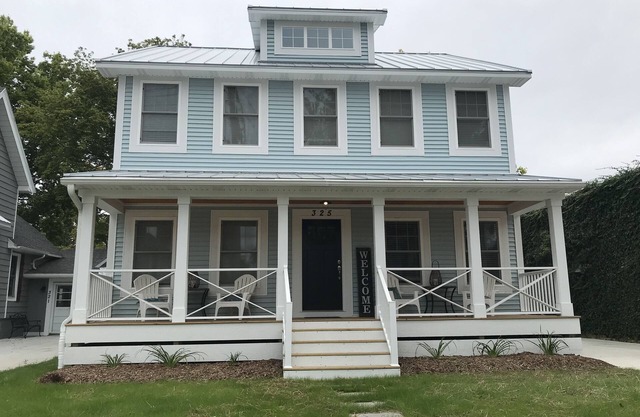 New Home with swim spa, theatre & game room. 1 block to town & close to beach.