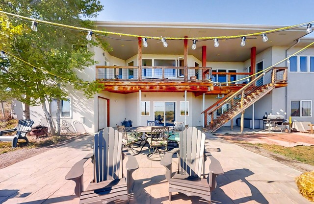 Newly built walkout basement with water views, patio, & Ping-Pong table