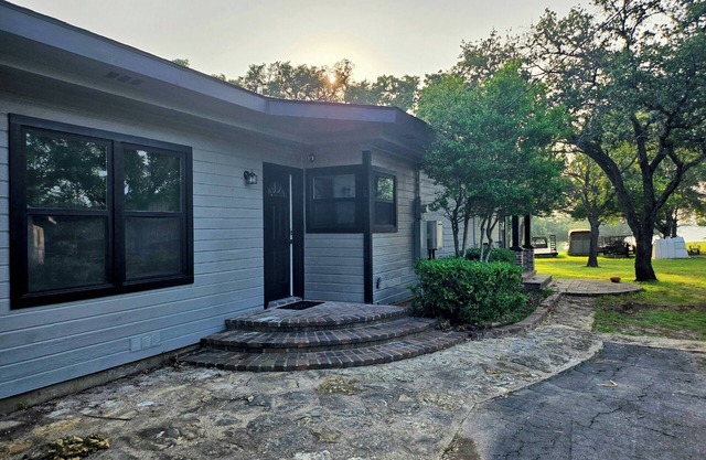 Newly Renovated 1.5 Acre Lake Front Home with Game Room and Direct Lake Access.