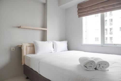 Nice and Strategic 2BR Apartment at Bassura City By Travelio