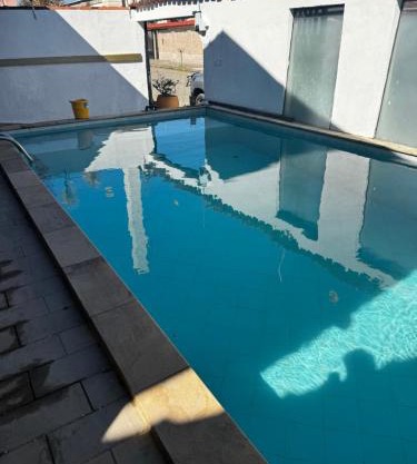 No Centro com Piscina Aquecida solar
