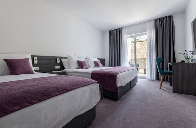 Novum-Hotel - Standard Triple Room with Balcony and Side Sea View 1