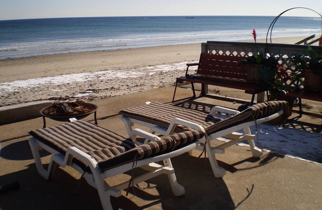 Ocean front directly on beach .