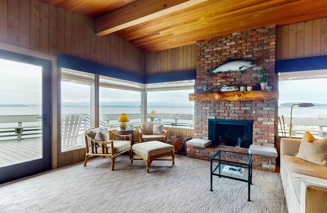 Oceanfront home with ocean views, beach access, large deck, fireplace, & W/D