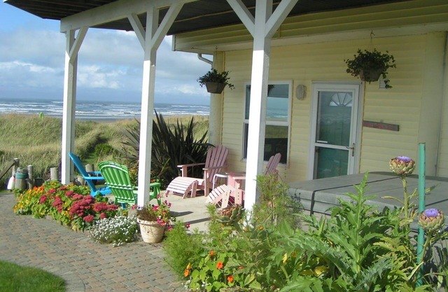 On the beach in MOCLIPS with hot tub, fireplace, BBQ, patio, beach access & more