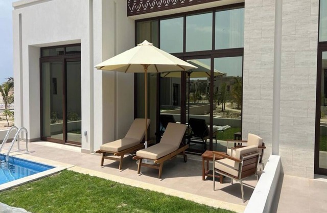 One-Bedroom Oasis with Pool View