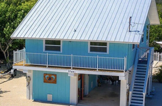 PADGETT PARADISE with Two Boat Slips with Filet Table. POOL