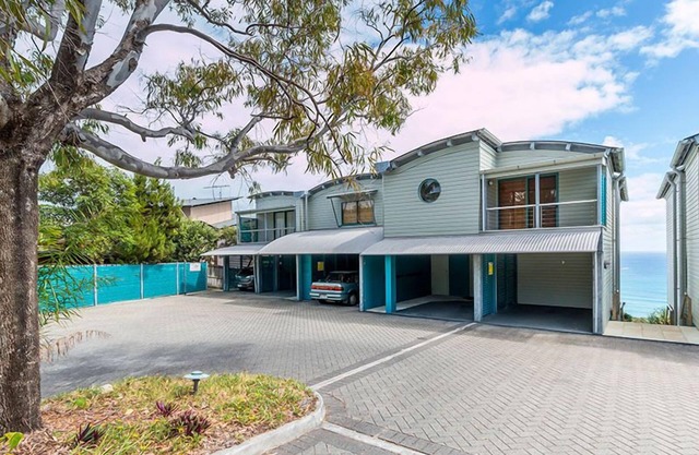 Panoramic ocean and beach views from this beautifully appointed two.