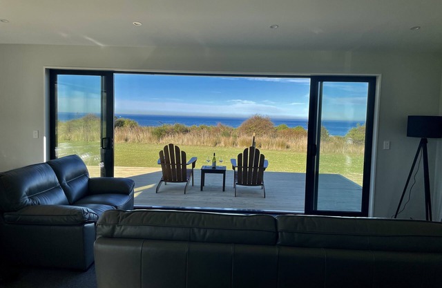 Panoramic views of the ocean close enough to the beach to hear the waves.
