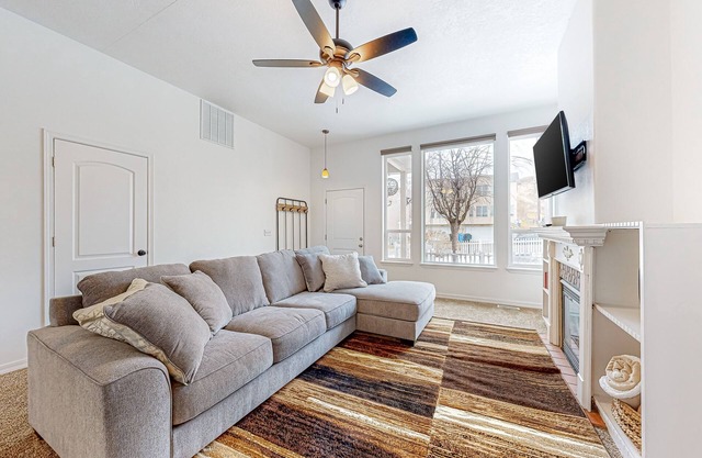Perfectly located home with mountain views, gas fireplace, patio, & streaming