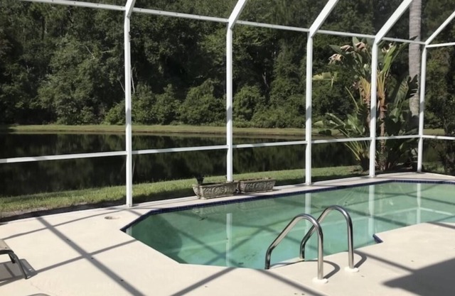 Perfectly placed by-beach & city 4 bd 2.5 b pool w pond & preserve view